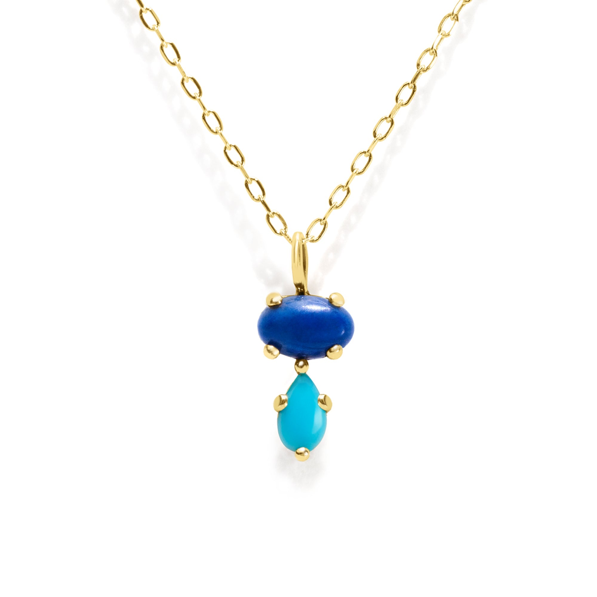 Add a vibrant touch of color with our Bubble Drop Necklace, featuring an oval lapis lazuli and a pear-cut turquoise, set in solid 14K gold. Inspired by the beauty of a cool summer night by the beach, this delicate blue gemstone necklace evokes the deep blue sky above the clear ocean. Perfect for everyday wear or as a thoughtful gift.