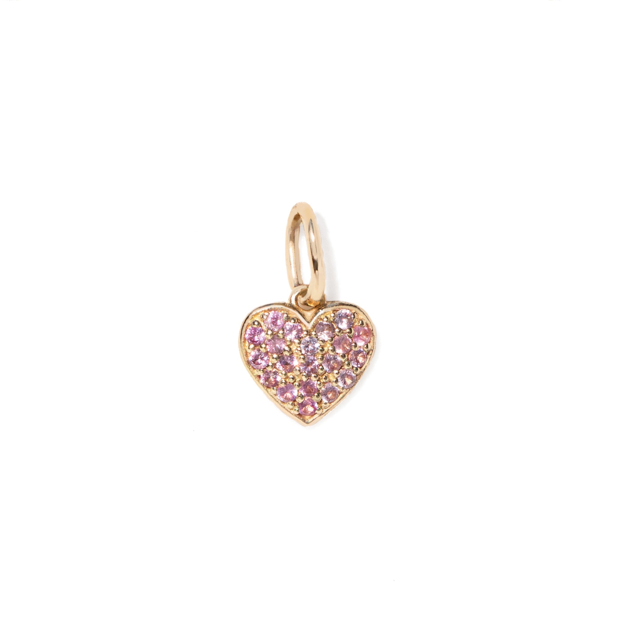 Heart-shaped gold charm with pink stones on a white background