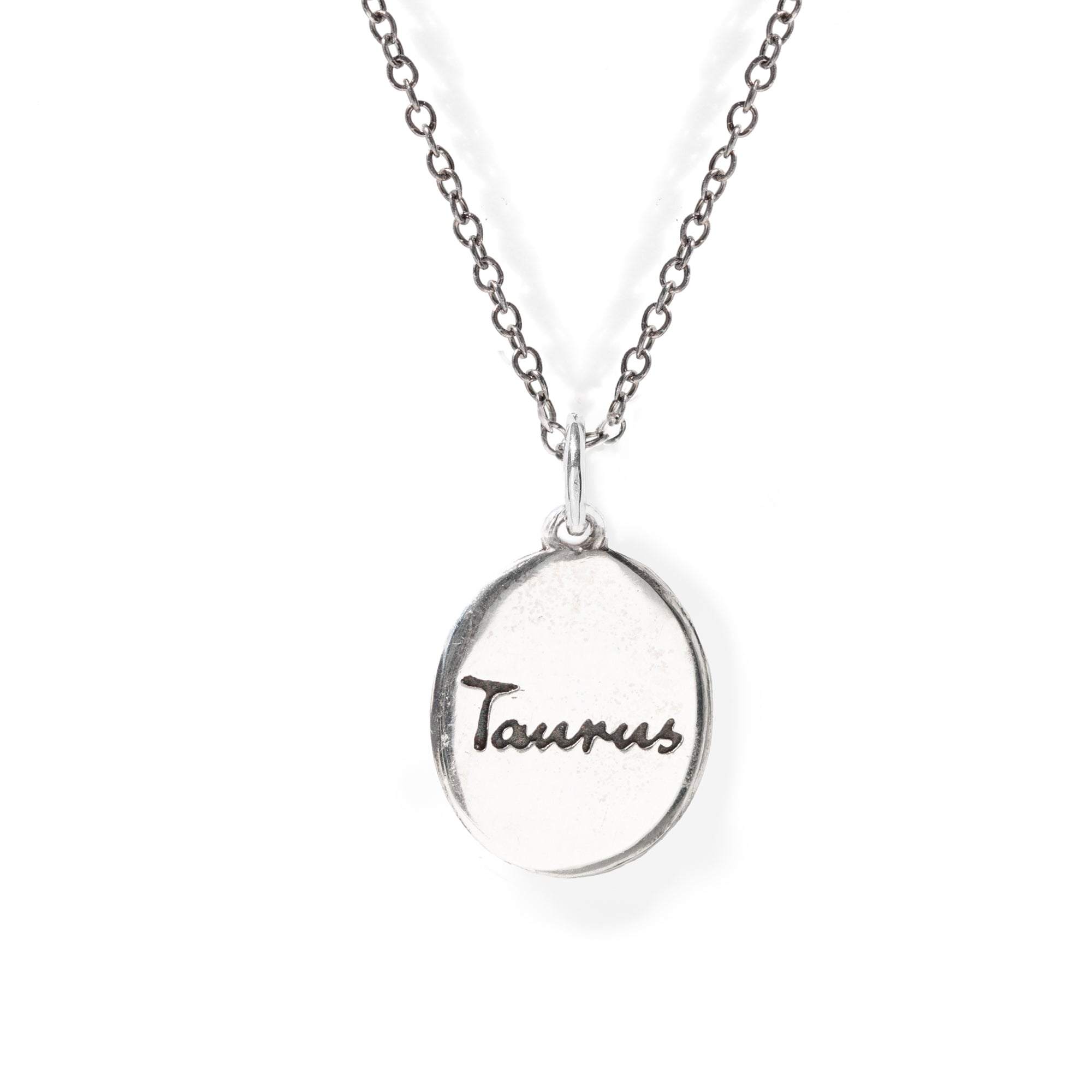 Silver necklace with 'Taurus' pendant on a white background