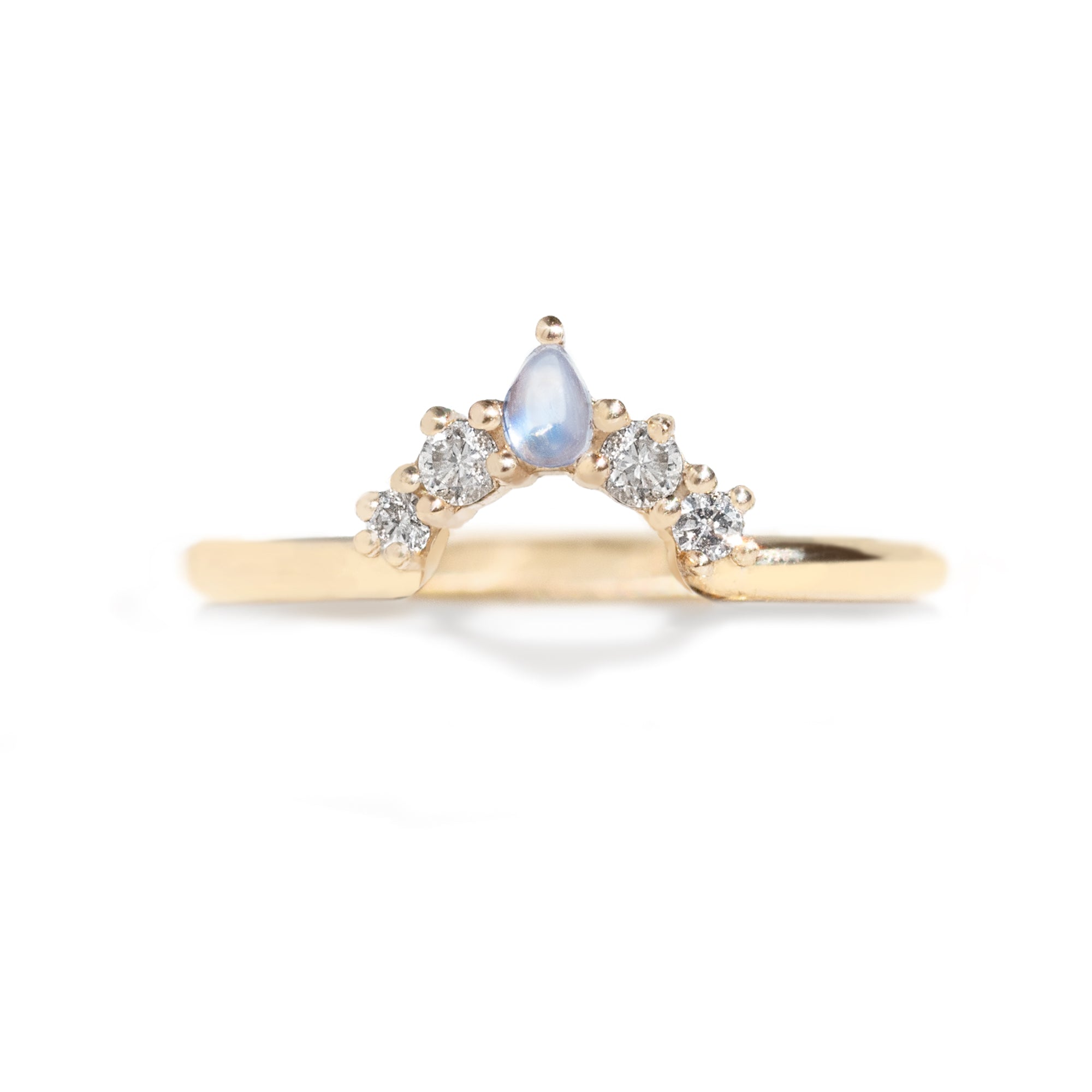  The Blossom Moonstone Contour Band is hand-crafted to complement the stunning Grace Moonstone Ring. Its pear-shaped moonstone perfectly complements the main ring's oval gemstone. 