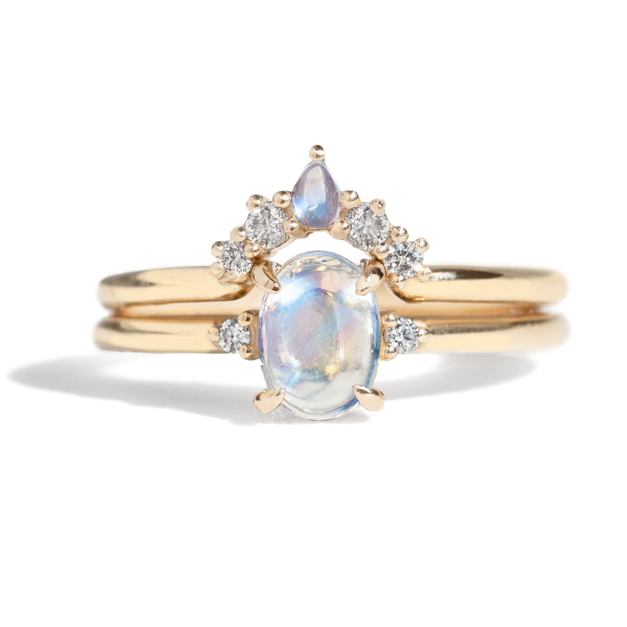  The Blossom Moonstone Contour Band is hand-crafted to complement the stunning Grace Moonstone Ring. Its pear-shaped moonstone perfectly complements the main ring's oval gemstone. 