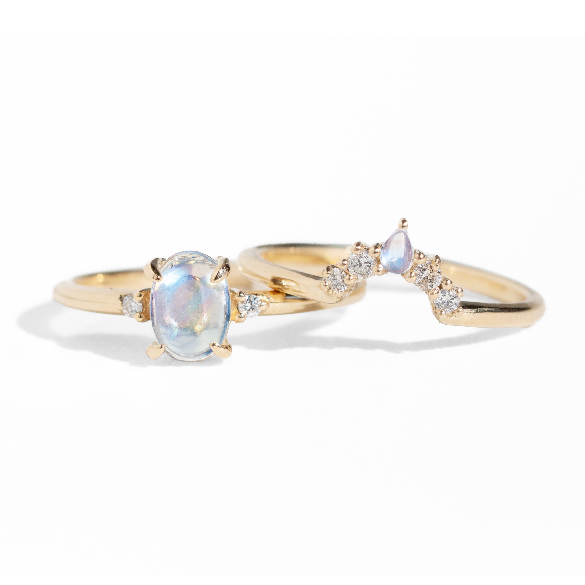 The classic Grace Ring's three stone design makes it perfect for your special day. This unique ring features an oval rainbow moonstone adorned with small diamonds, making it a truly one-of-a-kind piece. Pair this ring with Blossom Moonstone Contour Band to create your dream ring stack. 