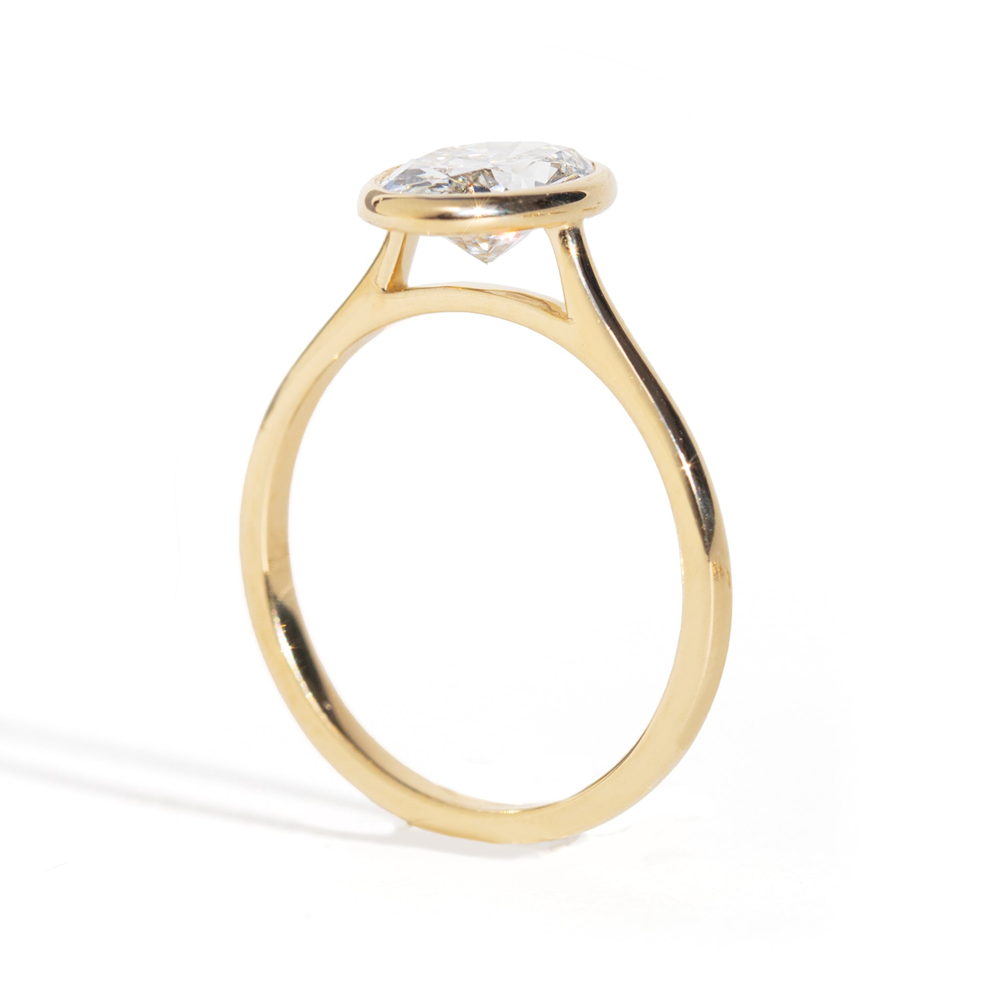 Oval Diamond Ring in gold on a white background