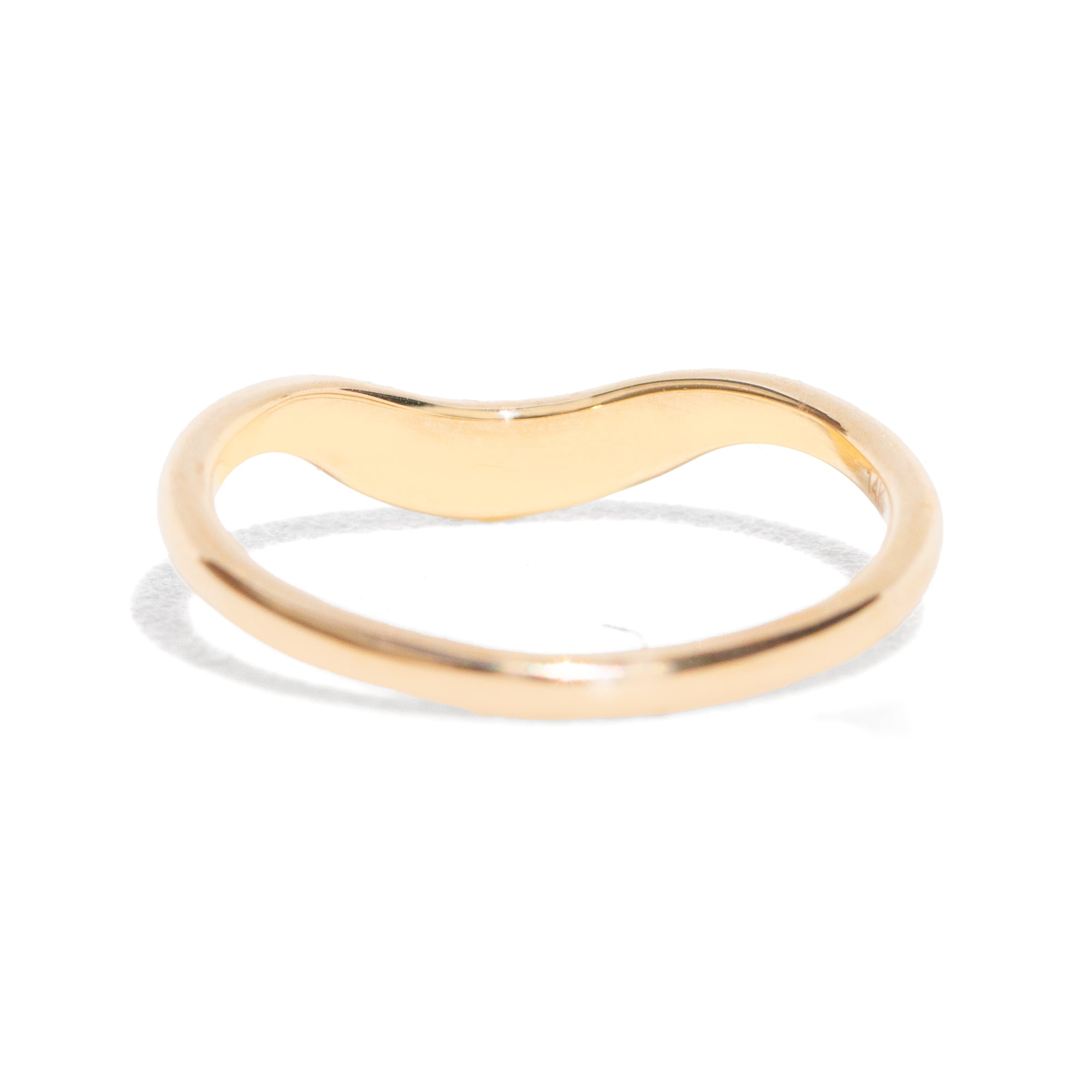 This gently curved, sculpted Starburst Diamond Contour Band is designed to complement your engagement ring with effortless elegance. Its graceful silhouette and subtle sparkle make it a timeless accent to your ring stack.