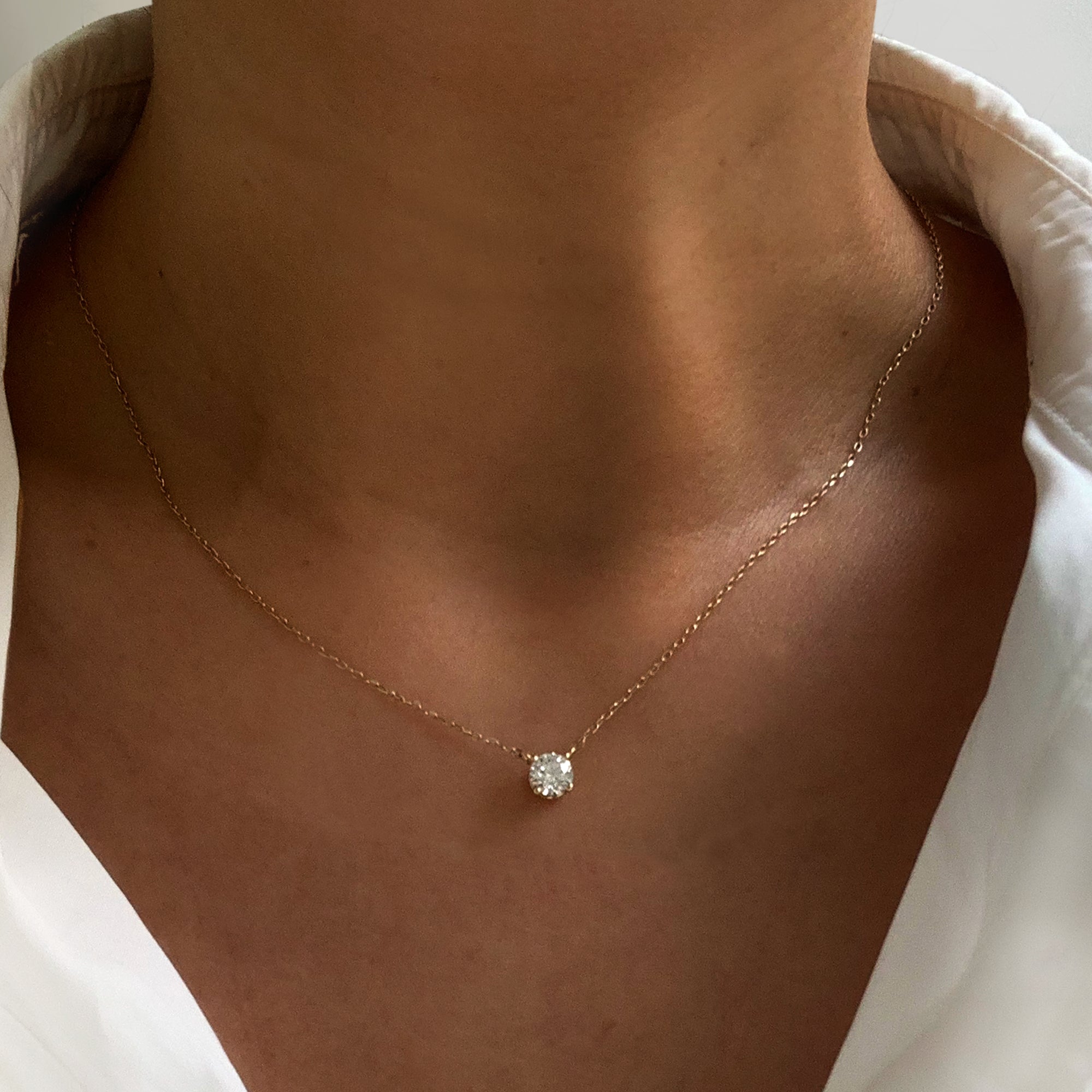 Jamie Park Jewelry - Round Diamond Solitaire Necklace This Round Diamond Solitaire Necklace features a sparkling lab diamond, set in a classic four prong design. With each diamond certified by IGI, this necklace makes for a timeless and cherished gift, perfect for any special occasion. Add a touch of elegance to any outfit with this beautiful piece. Chain length 16-18" 