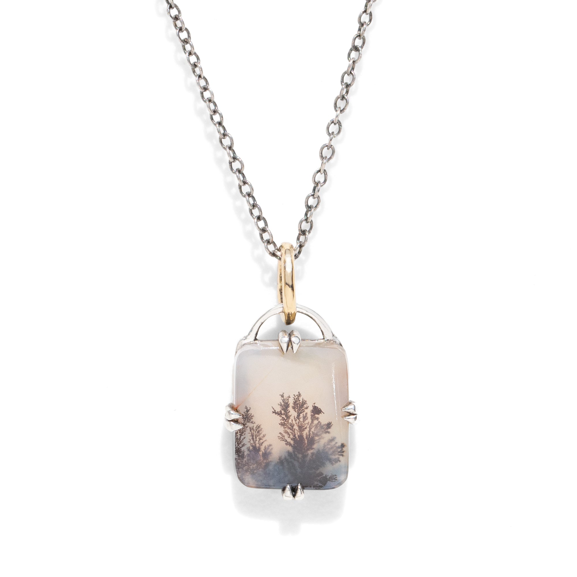 A rectangular gemstone pendant necklace against a white background.