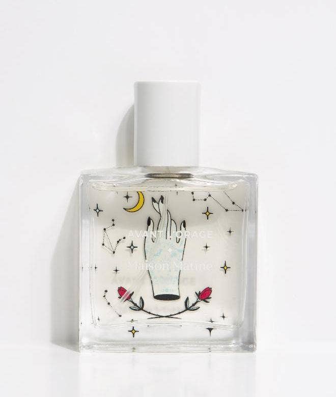 Perfume bottle with artistic design on a white background