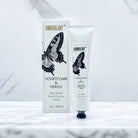 Shea butter hand and body crème with packaging featuring a butterfly design on a white background