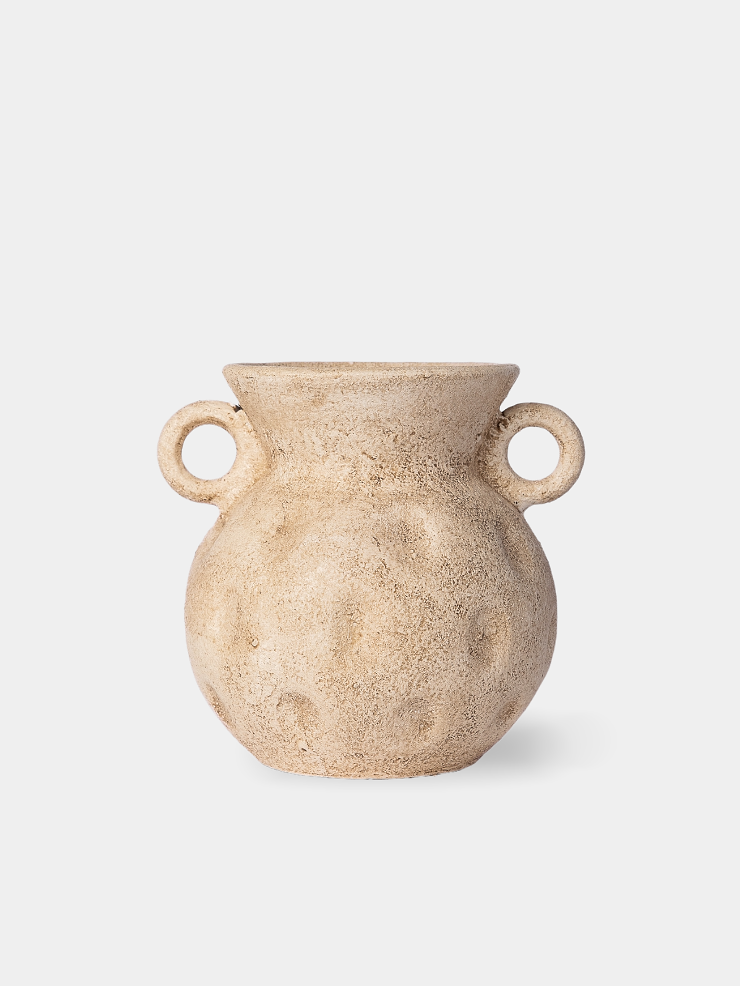 Beige ceramic vase with two handles on a white background
