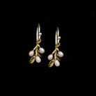 Pair of earrings with floral design on a black background