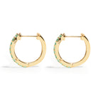 Thorn_Hoops_Emerald_Bold yet refined, the Thorn Emerald Hoop features a delicate thorn silhouette accented with vibrant emeralds. Edgy and elegant, it’s designed for those who love a touch of drama in an understated form.
