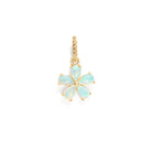 A floral shaped , five gemstone pendant in gold color against a white background. 