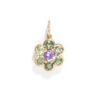 A gemstone charm in gold color against a white background