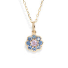 A gemstone necklace against a white background