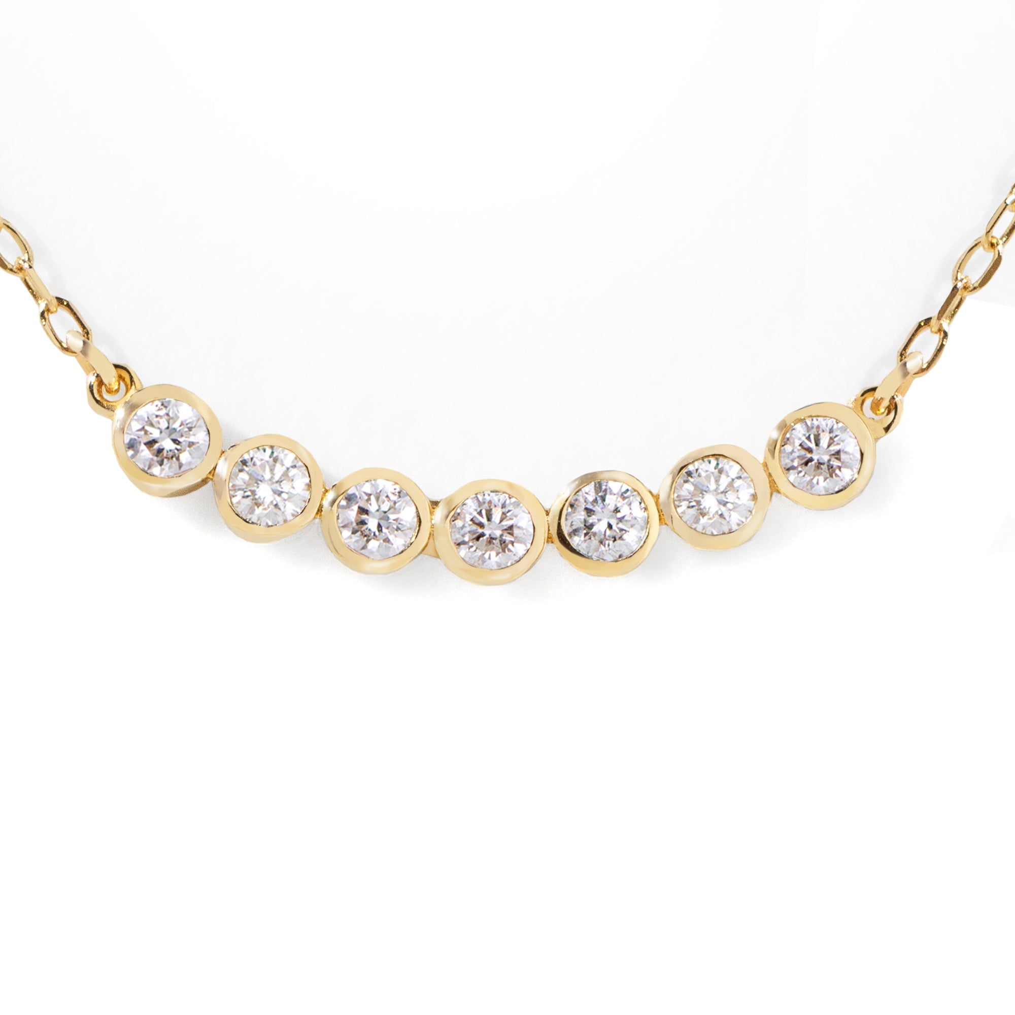 This customer's favorite Seven Diamond Necklace is a go-to for any wardrobe. Effortlessly dressing up any look for the office, it can also be used to add a touch of sparkle for an evening out. Its sleek design makes it perfect for solo or layered styling. 16-18" adjustable size.