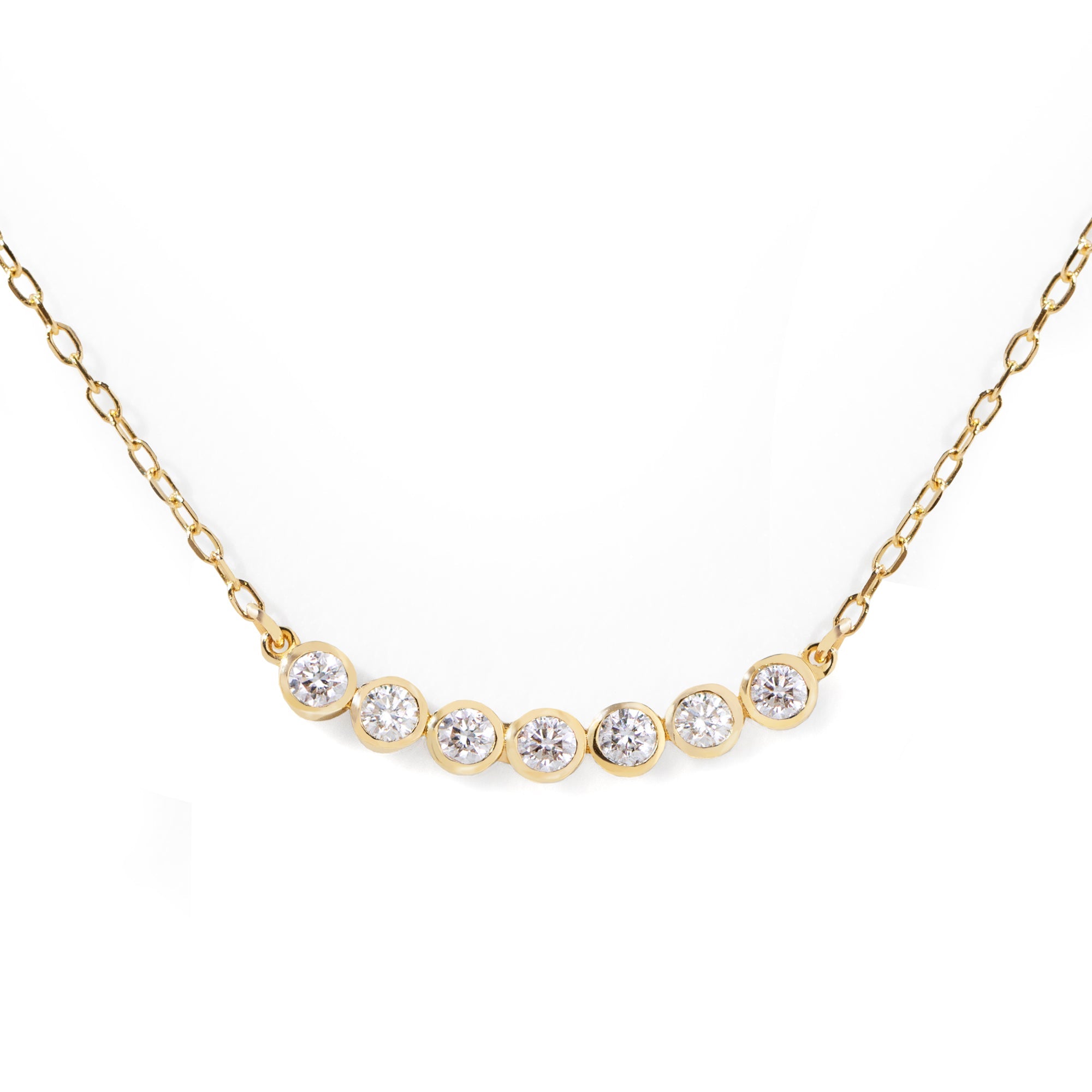 This customer's favorite Seven Diamond Necklace is a go-to for any wardrobe. Effortlessly dressing up any look for the office, it can also be used to add a touch of sparkle for an evening out. Its sleek design makes it perfect for solo or layered styling. 16-18" adjustable size.