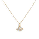 Gold necklace with an diamond accented evil eye pendant on a white background