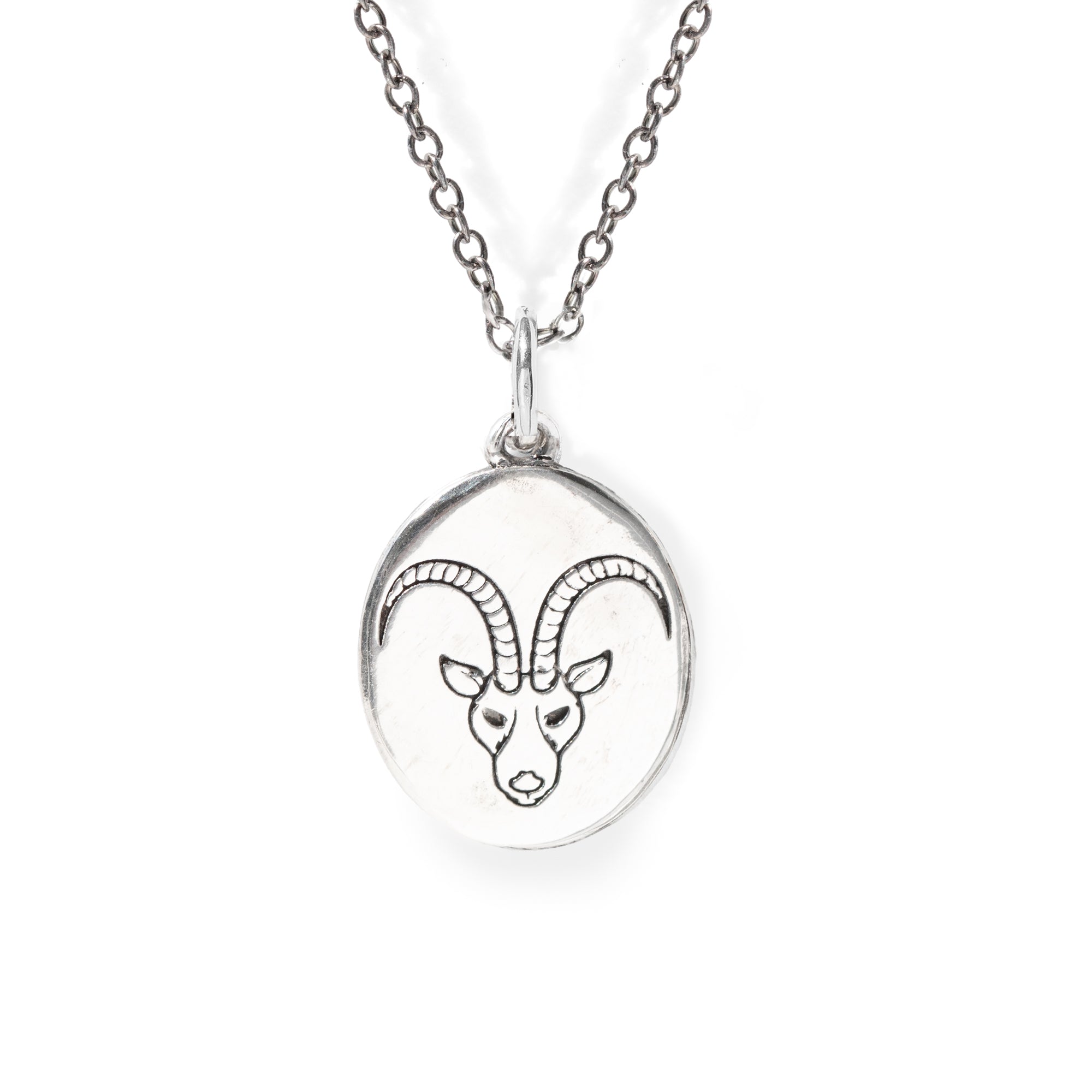 Silver necklace with a pendant featuring an engraved ram's head on a white background