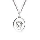 Silver necklace with a pendant featuring an urn design on a white background