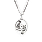Silver necklace with a pendant featuring two fish on a white background