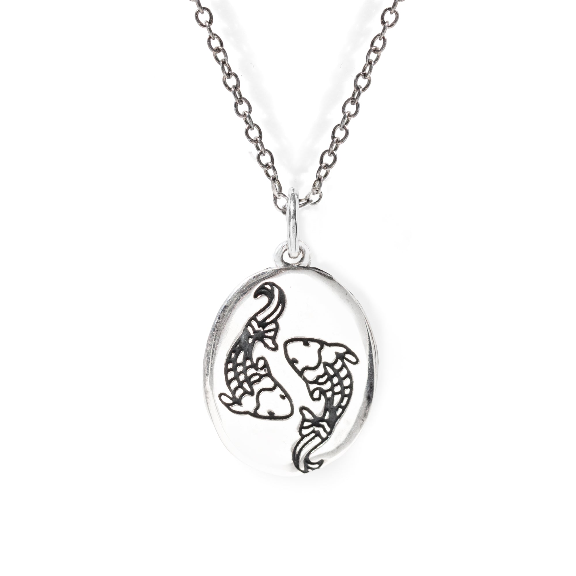 Silver necklace with a pendant featuring two fish on a white background