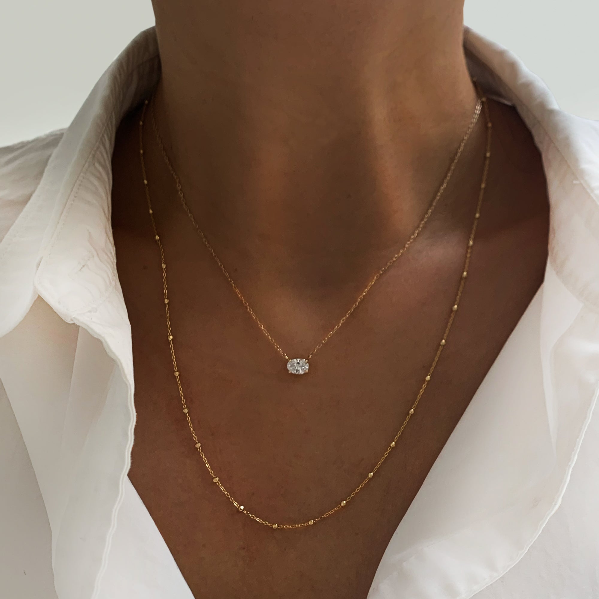 Jamie Park Oval Diamond Solitaire Necklace This Oval Diamond Solitaire Necklace features a sparkling lab diamond, set in a classic four prong design. With each diamond certified by IGI, this necklace makes for a timeless and cherished gift, perfect for any special occasion. Add a touch of elegance to any outfit with this beautiful piece. Chain length 16-18"&nbsp;