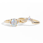 The classic Grace Ring's three stone design makes it perfect for your special day. This unique ring features an oval rainbow moonstone adorned with small diamonds, making it a truly one-of-a-kind piece. Pair this ring with Blossom Moonstone Contour Band to create your dream ring stack.&nbsp;