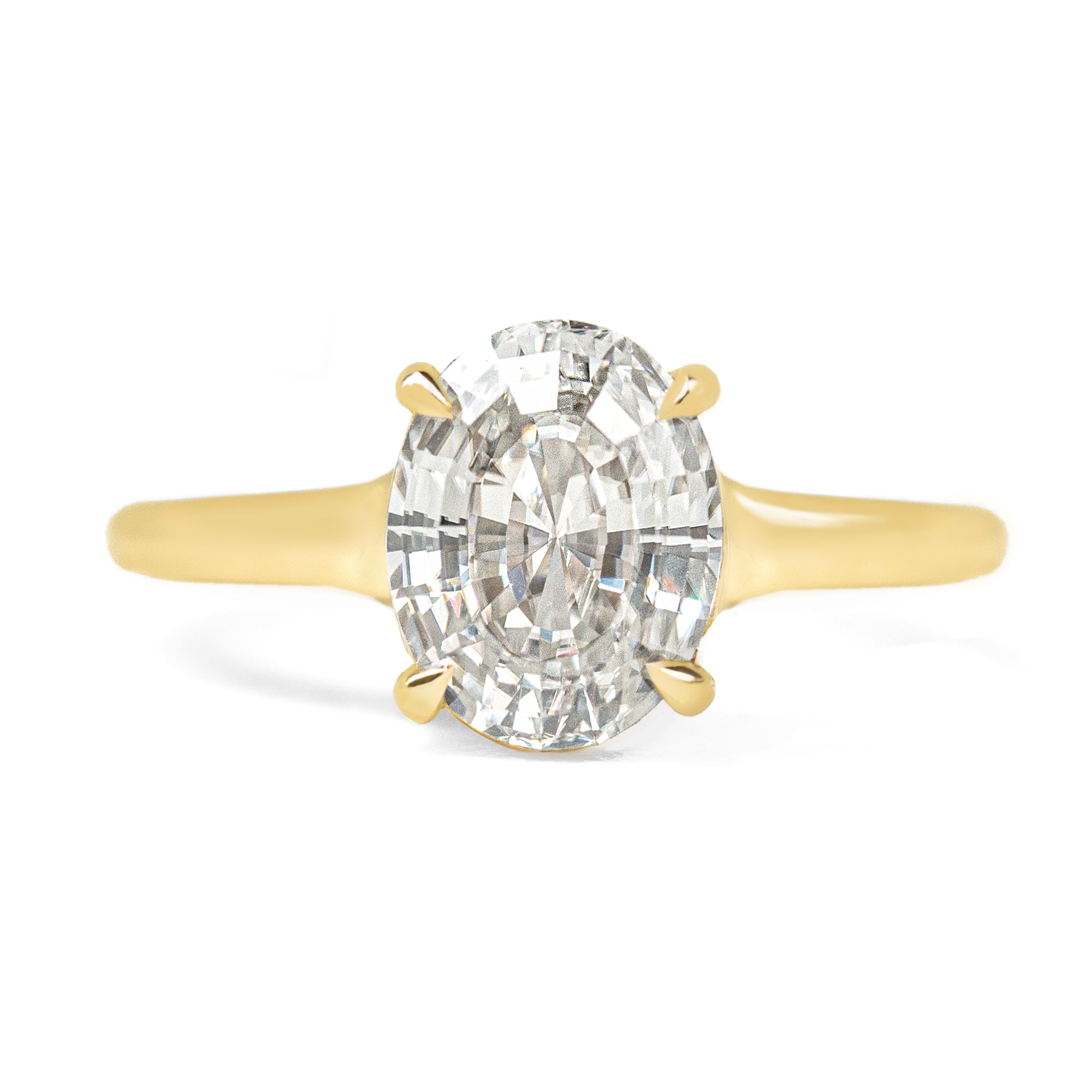 Oval step cut 2ct diamond ring on white background 