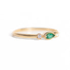 Made for vintage lovers, this Marquise Emerald Three Stone Ring features a bold green emerald in a marquise cut, complemented by sparkling diamonds on either side, all set in a beautiful milgrain setting. Its elegant yet understated design makes it ideal for everyday wear, a thoughtful gift, or as a delicate engagement ring.