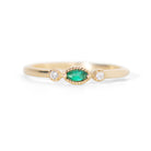 Made for vintage lovers, this Nokes Ring features a bold green emerald in a marquise cut, complemented by sparkling diamonds on either side, all set in a beautiful milgrain details. Its understated design makes it ideal for everyday wear, a thoughtful gift, or as a delicate engagement ring.