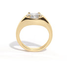 A gold band ring with an oval-shaped diamond set in an east-west orientation.