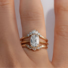 Gold milgrain ring with a 1.5 carat old mine cut diamond stacked with diamond bands on a hand 
