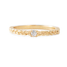 Add effortless elegance to your everyday style with the Meadow Diamond Ring. The intricate Meadow pattern exudes sophistication, making it a perfect choice for both casual and formal occasions. Elevate your look with this beautiful and versatile piece, perfect as a delicate engagement ring or as a complement to your wedding band.