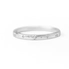 Bracelet with gray beads and a silver clasp on a white background
