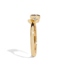 Gold ring with a diamond on a white background