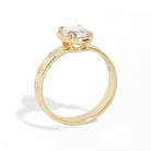Gold ring with a diamond on a white background
