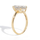 Gold ring with a diamond on a white background