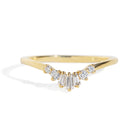 Gold ring with diamond accents on a white background