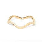 Gold ring with a wavy design on a white background