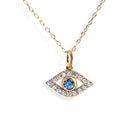 Gold necklace with an eye-shaped pendant featuring a blue gemstone on a white background