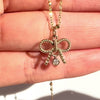 The Diamond Bow Necklace features a stunning natural diamond charm at its center, set on a delicately twisted bow charm, making it the perfect diamond piece for everyday wear. Crafted in solid 14K gold, it seamlessly blends modern elegance with a romantic, vintage-inspired allure.
