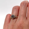 The Joy is designed with a 1.11CT salt and pepper diamond set on a 1/3 total CT luxurious diamond band. The center stone features a romantic yet unique cut, radiating sparkles with every movement. The slightly raised cathedral setting sits flush with your favorite bands, adding to its elegance and versatility.