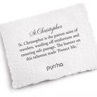 White pillow with text about St. Christopher and branding on a white background